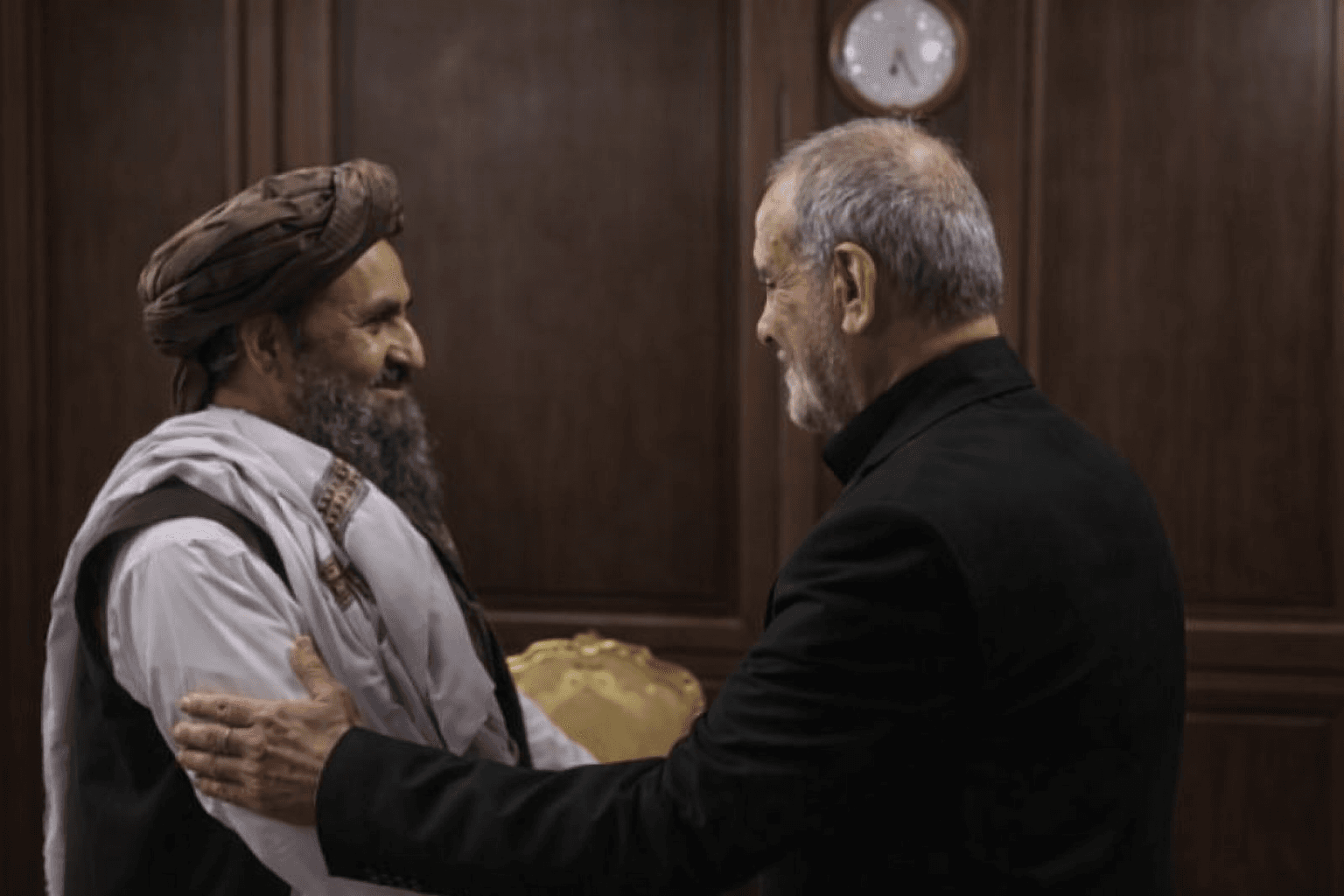 Meeting between the President of Iran and a senior Taliban official on the sidelines of a ceremony in Tehran.